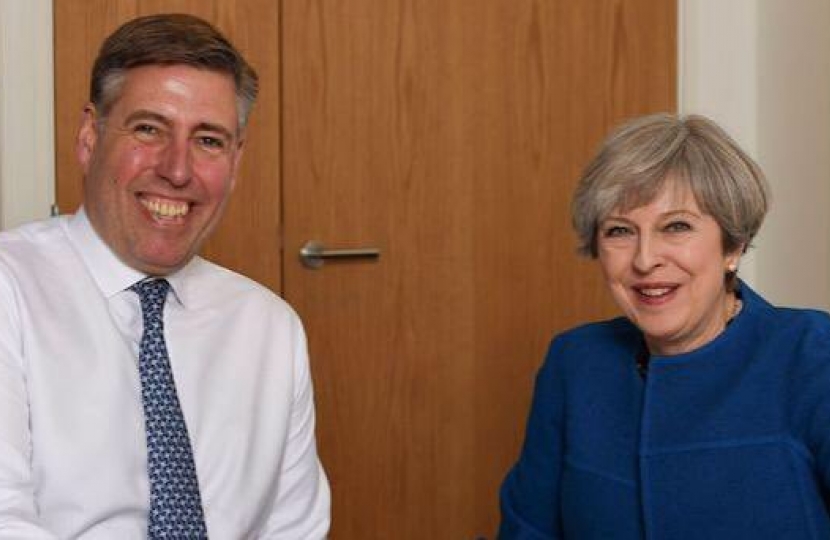 Sir Graham with Theresa May